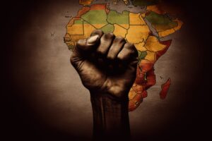 A powerful raised fist symbolizing African unity, strength, and cultural pride against the backdrop of a colorful map of Africa.