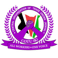 Official logo of the Central Organization of Trade Unions (Kenya), featuring a purple circular emblem with laurel branches, Kenya’s flag colors inside the map outline, and two clasped hands symbolizing worker unity, with the motto ‘All Workers • One Voice.